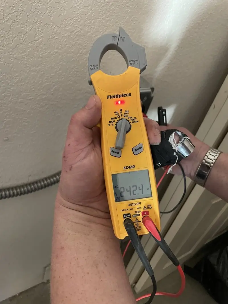 Voltage testing with clamp meter during Recessed Lighting Installation in Aberdeen